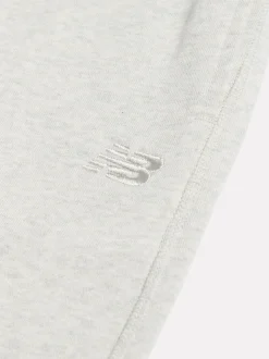 Gris - Joggings New Balance French terry coupe droite à petit logo