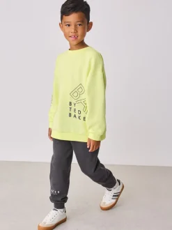 Jaune citron - Baker by Ted Baker Ensemble sweat-shirt et jogging graphique surdimensionné