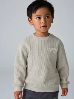 Sweat-shirt smALLSAINTS Underground oversize gaufré à col rond pour garçons