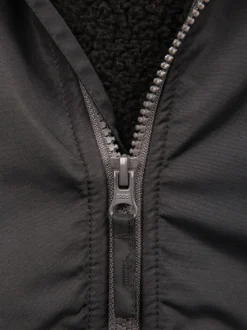 Veste Mountain Warehouse Robin enfant imperméable doublée en peau Borg